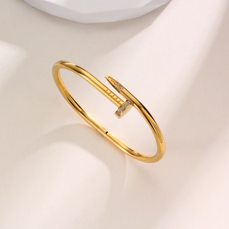 Pulsera clavo con brillantes dorado